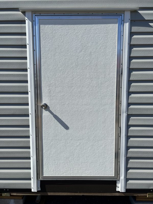 36×72-Single-Door-600×800 Portable storage building door with sleek design and metallic trim, showcasing customization options for Repo Lot's sheds.