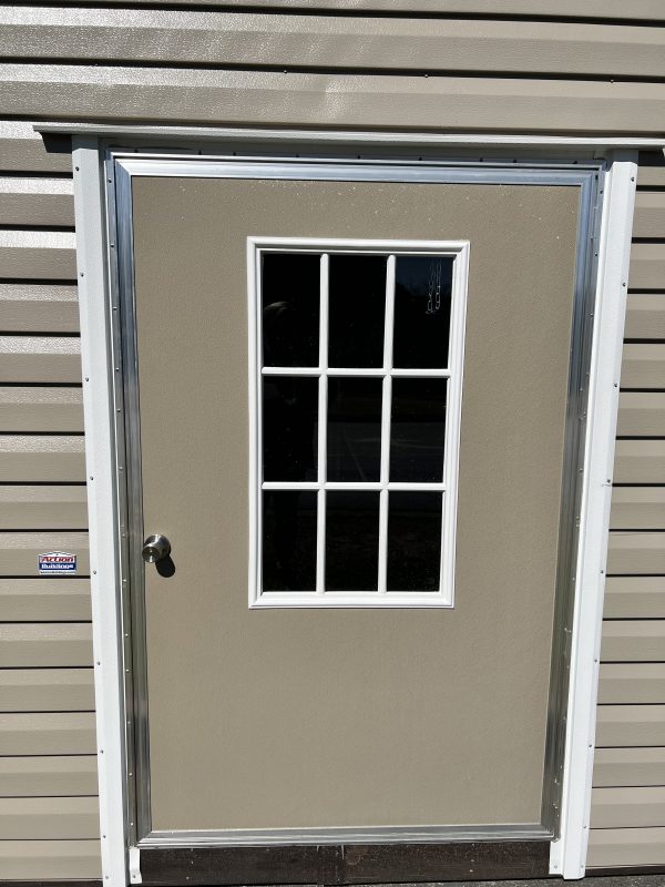 46×72-Single-Door-w-9-Light-600×800 Single door with nine-light window design, beige exterior, and metallic trim, featured on a portable storage building by Repo Lot.
