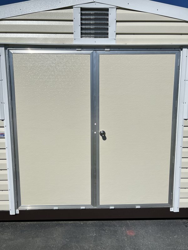 72×72-Double-Door-600×800 Double door entrance of a customizable portable storage building with a light-colored exterior and metal framing, highlighting options for portable buildings and sheds from Repo Lot.