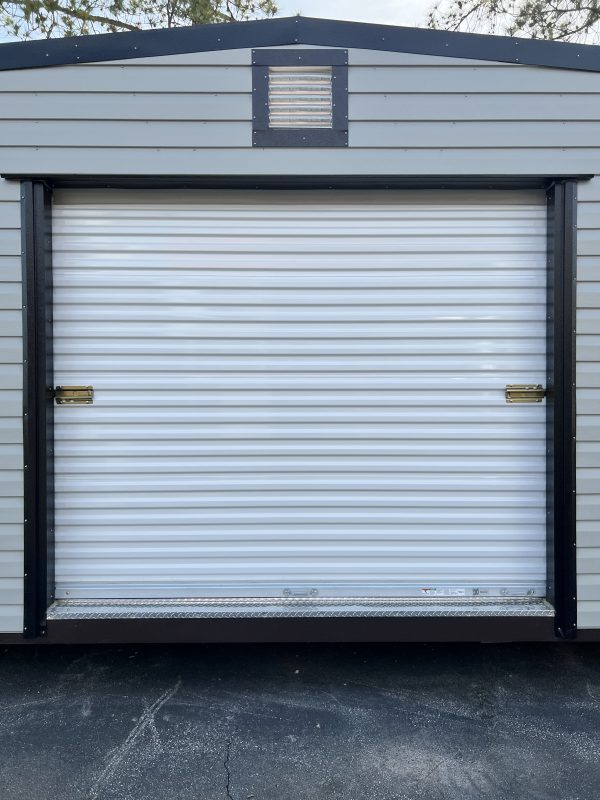 8×6-Rollup-Door-600×800 Portable storage building with a roll-up door and ventilation, showcasing customizable features for storage solutions.