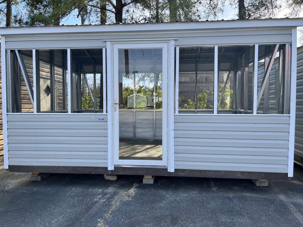 Screened-Room-Building-1200×900 Portable screened room building with large windows and door, showcasing customizable features for outdoor storage solutions.